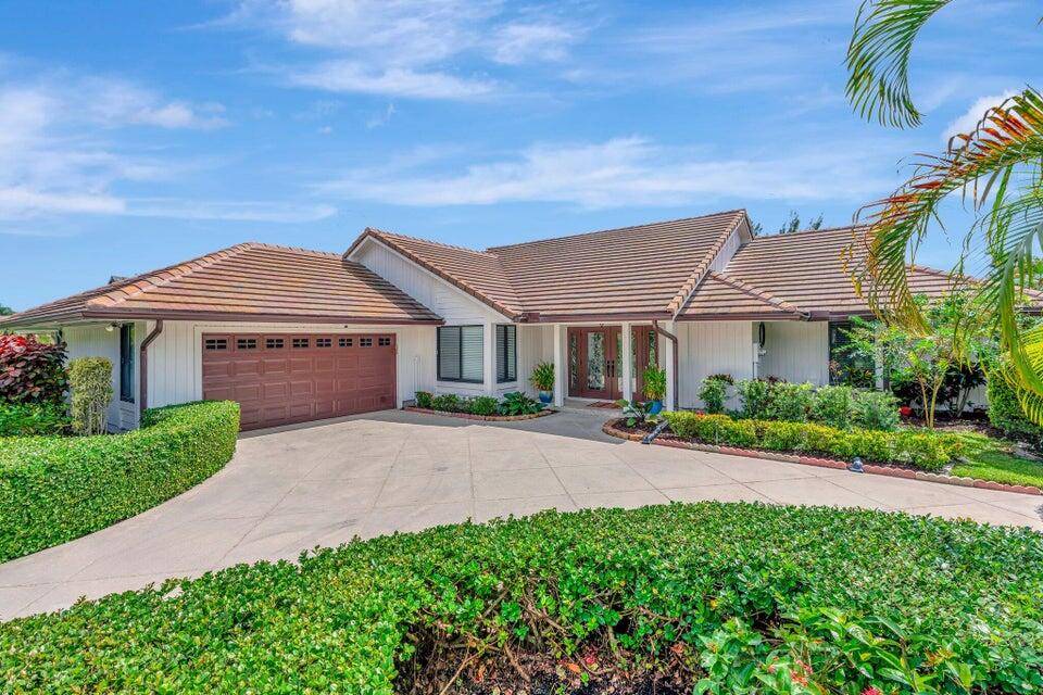 Escape to Palm Beach Gardens in this luxurious, private, one level pool home located in the exclusive gated community of Preston at PGA National.