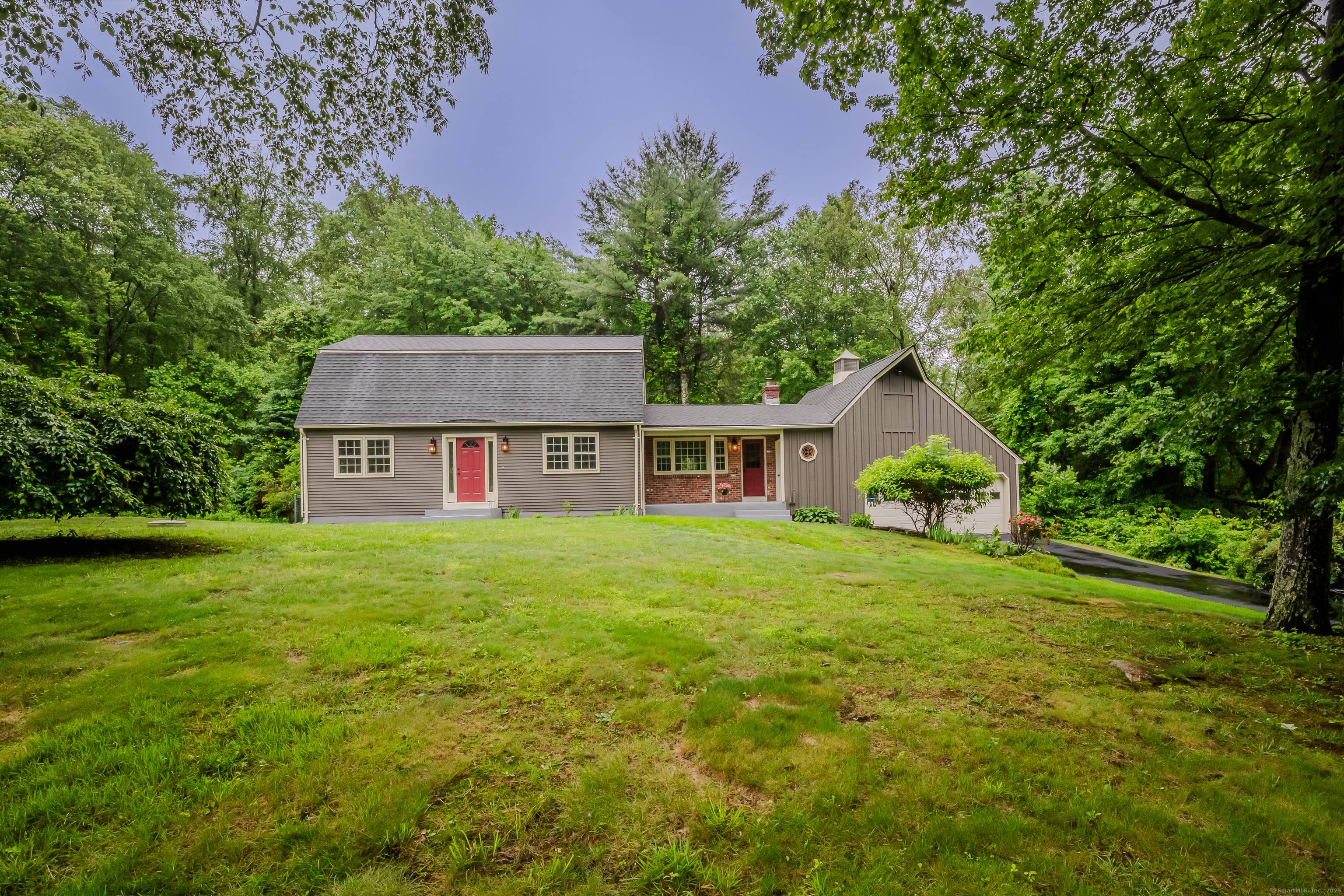 This stunning home features a modern kitchen adorned with beautiful quartz countertops, seamlessly flowing into a backyard oasis with a sparkling pool and wood deck perfect for entertaining and relaxation.