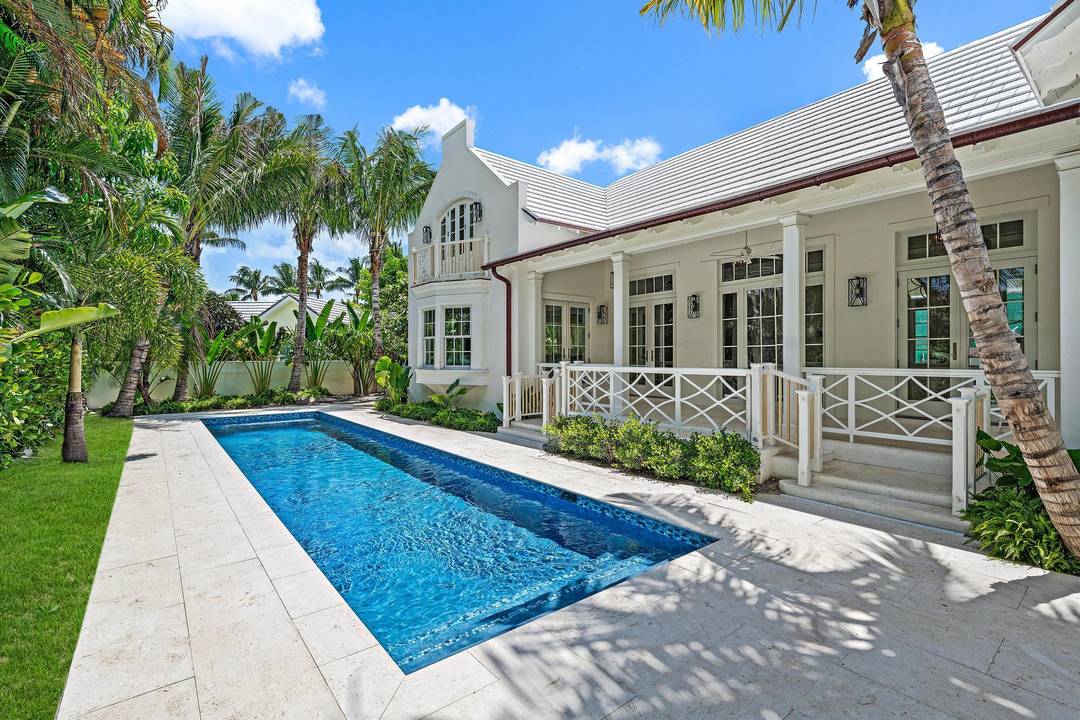 Classic architectural detail and design are highlighted throughout this elegant, brand new Palm Beach residence located just steps from the desirable lake trail.