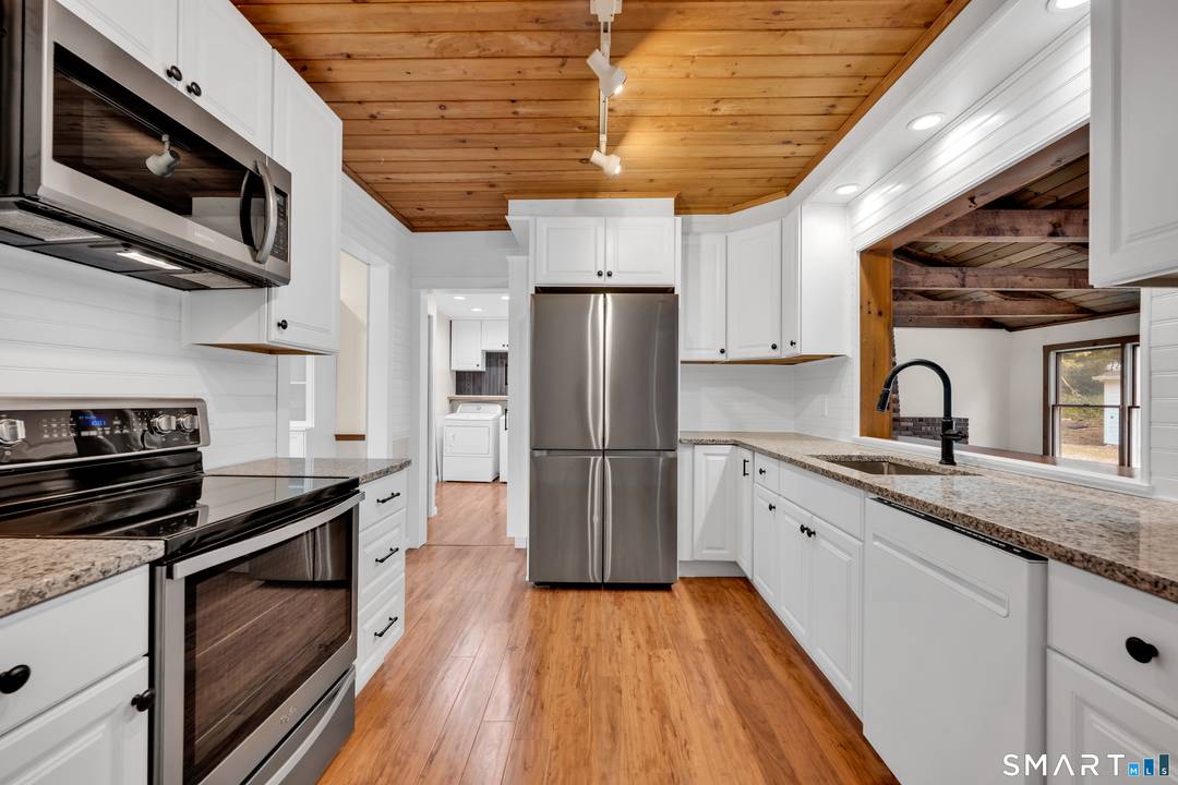 Welcome to this charming and versatile home in the heart of Milford !