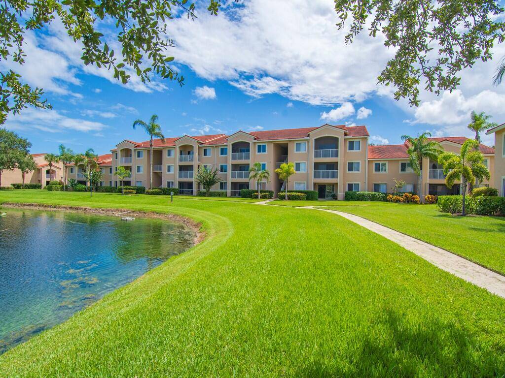 Enjoy serene lakefront views from this spacious 2 bedroom, 2 bath condo in the desirable gated community of Laguna of Vero Beach.