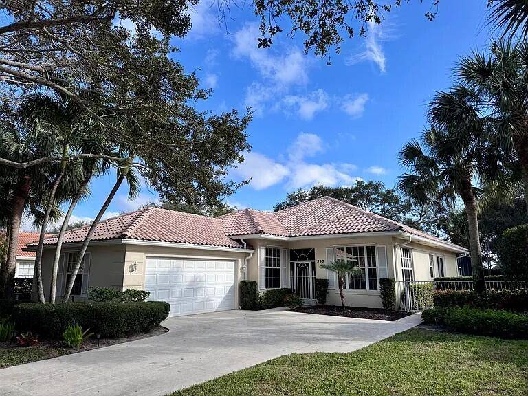 Single family home in the gated community of Oaks East in the heart of PB Gardens.
