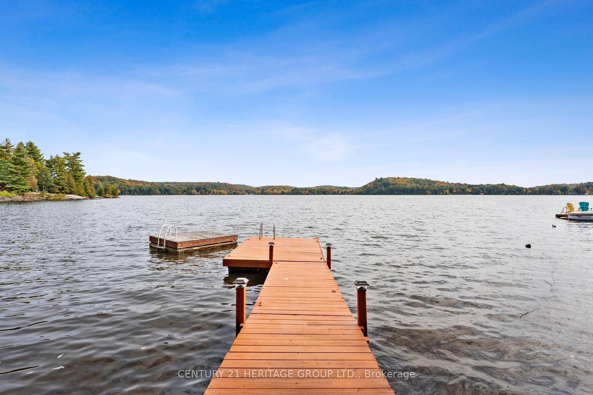 Perfect Three Season Cottage on Three Mile Lake in Muskoka Lake Breathtaking View Beautiful Waterfront Elegance and a Warm, Welcoming Atmosphere A Well Maintained Dock Extends Out Onto the Lake, ...