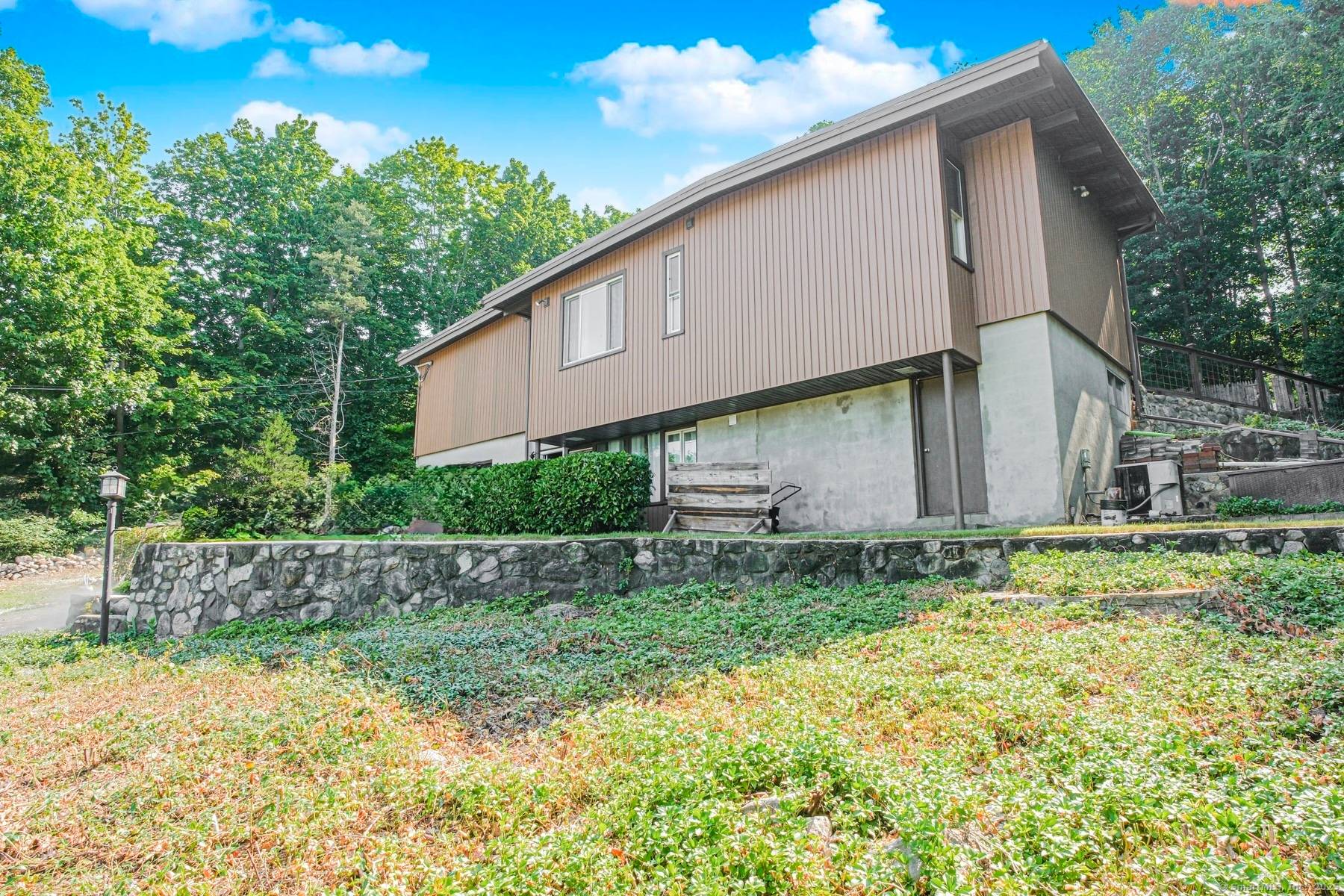 Charming and updated 4 bedroom Colonial set on a beautifully landscaped lot in the heart of Darien.