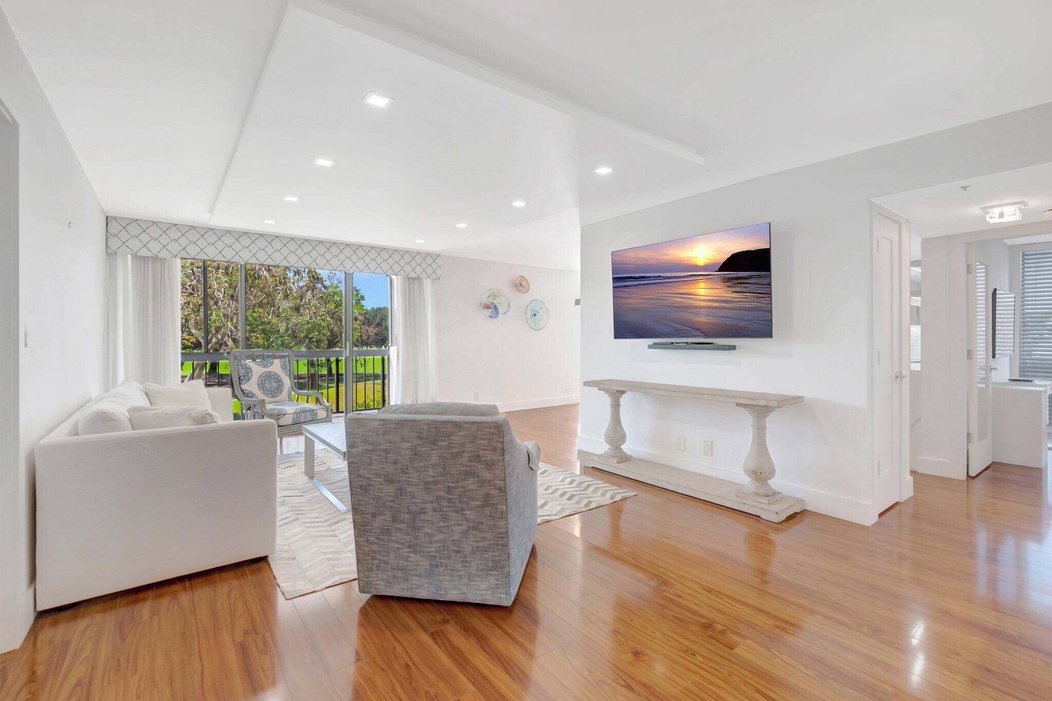 Beautifully renovated corner unit with spectacular golf course views.