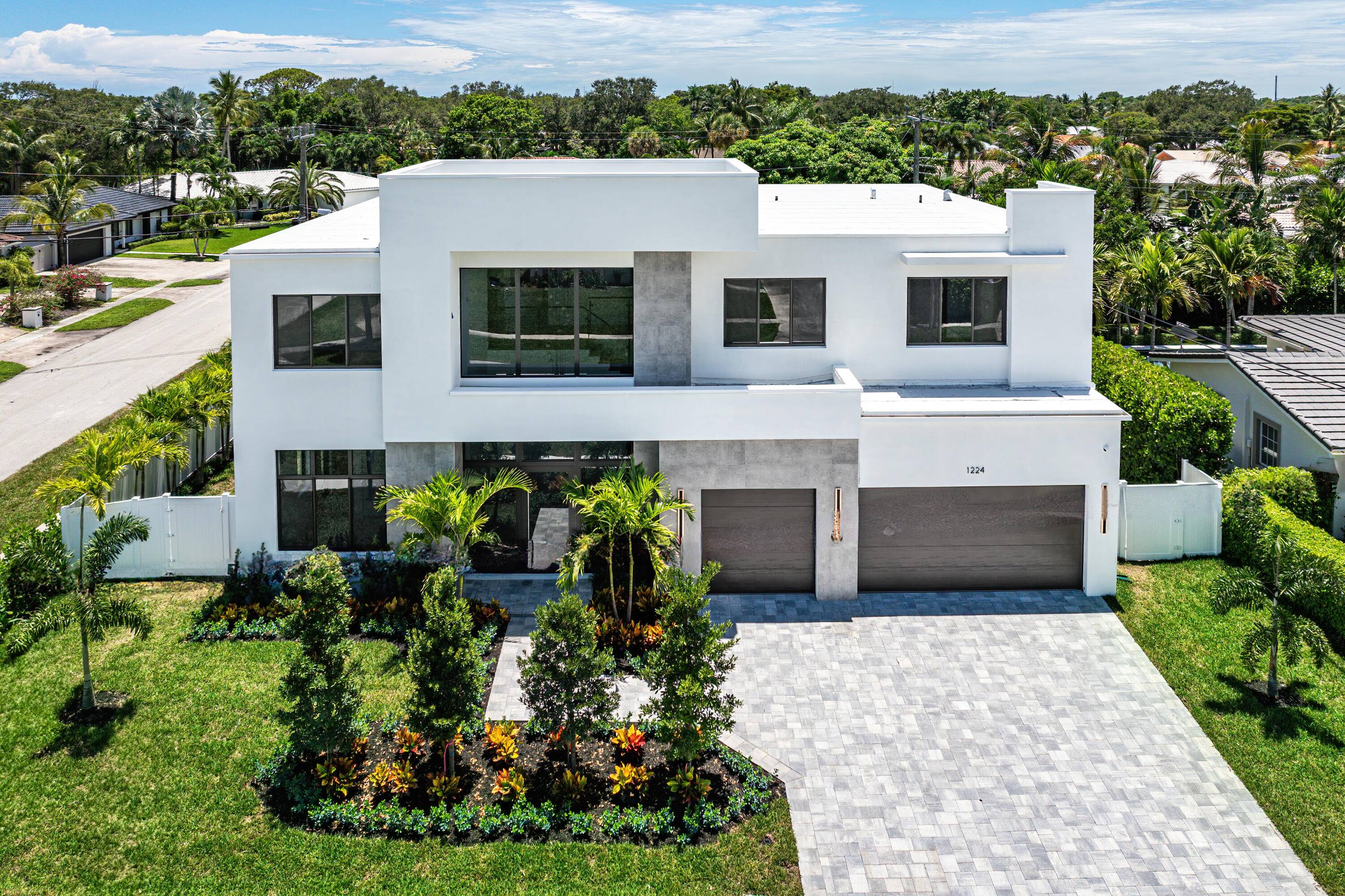 Situated on a prime corner lot in the heart of Boca Square, this stunning new construction home by Regal Pads Development delivers modern design, exceptional functionality, and a location within ...