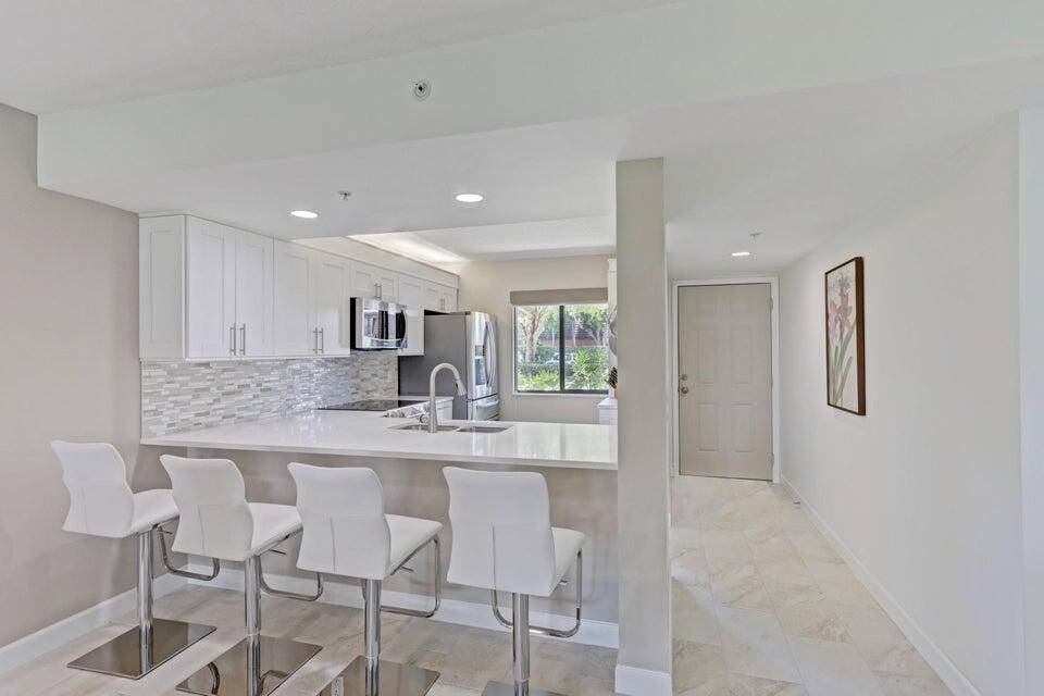Are you looking for a ground floor condo with a water view that is updated to the max ?