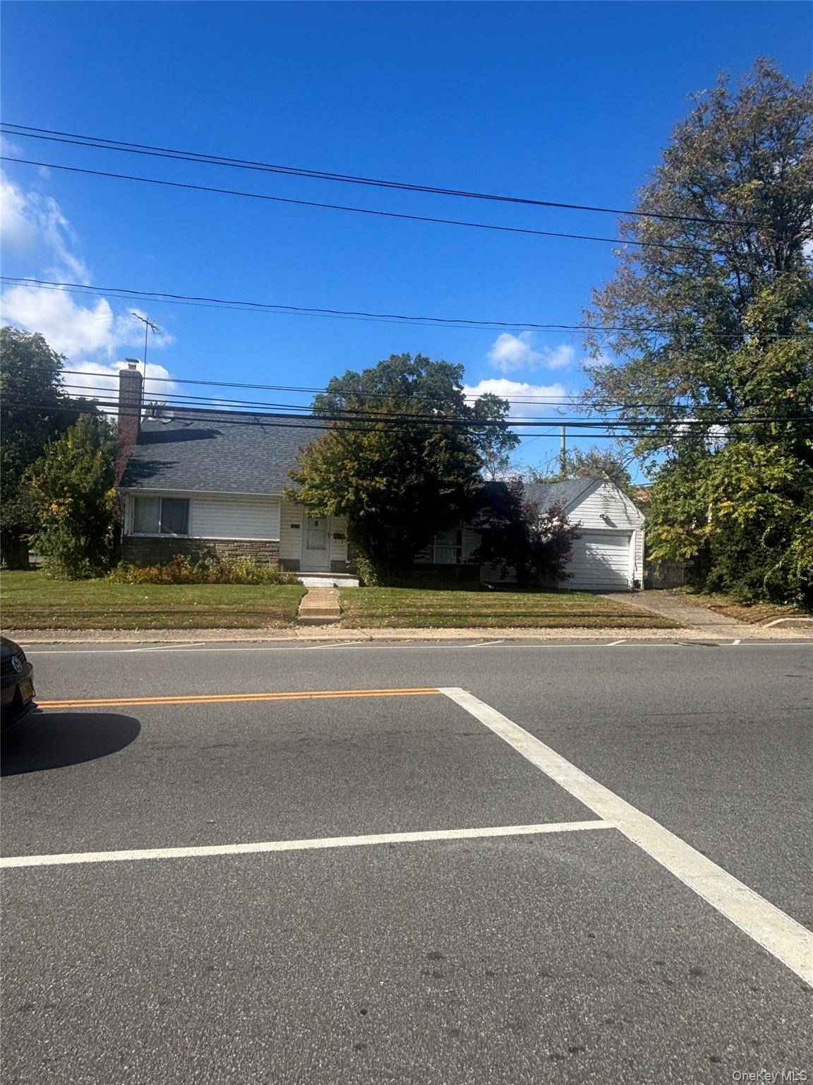 This is a detached huge wide line cape, corner property with a garage and rear deck.