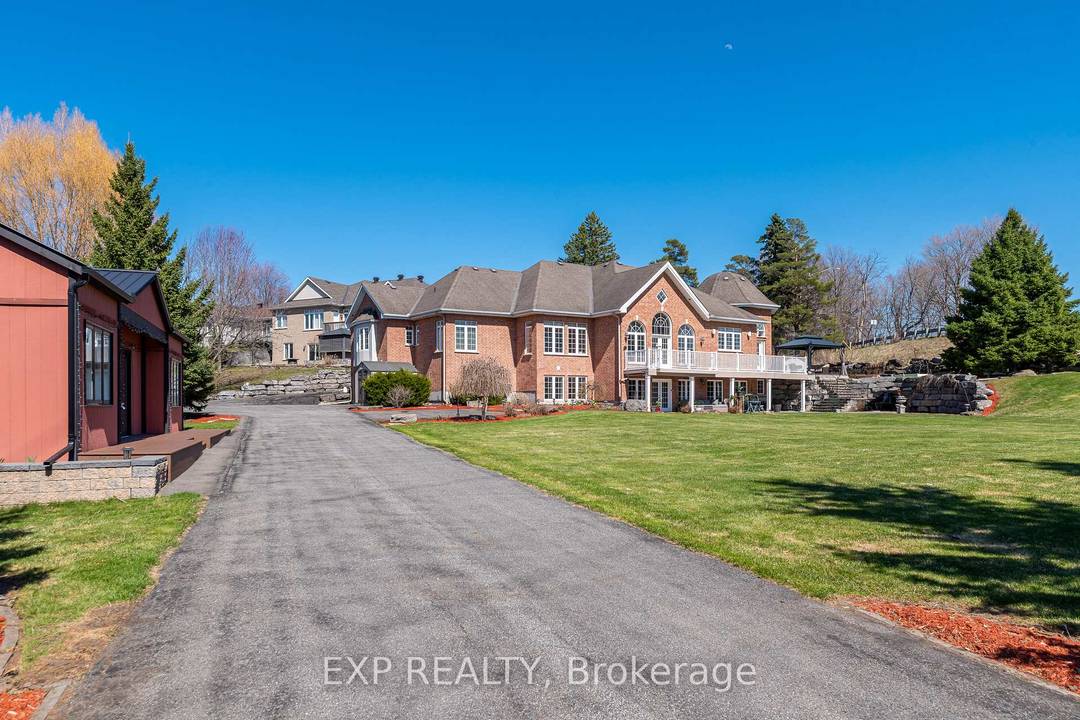 Welcome to 1283 Rideau Cove Court an extraordinary gated estate offering over 7, 000 sq.
