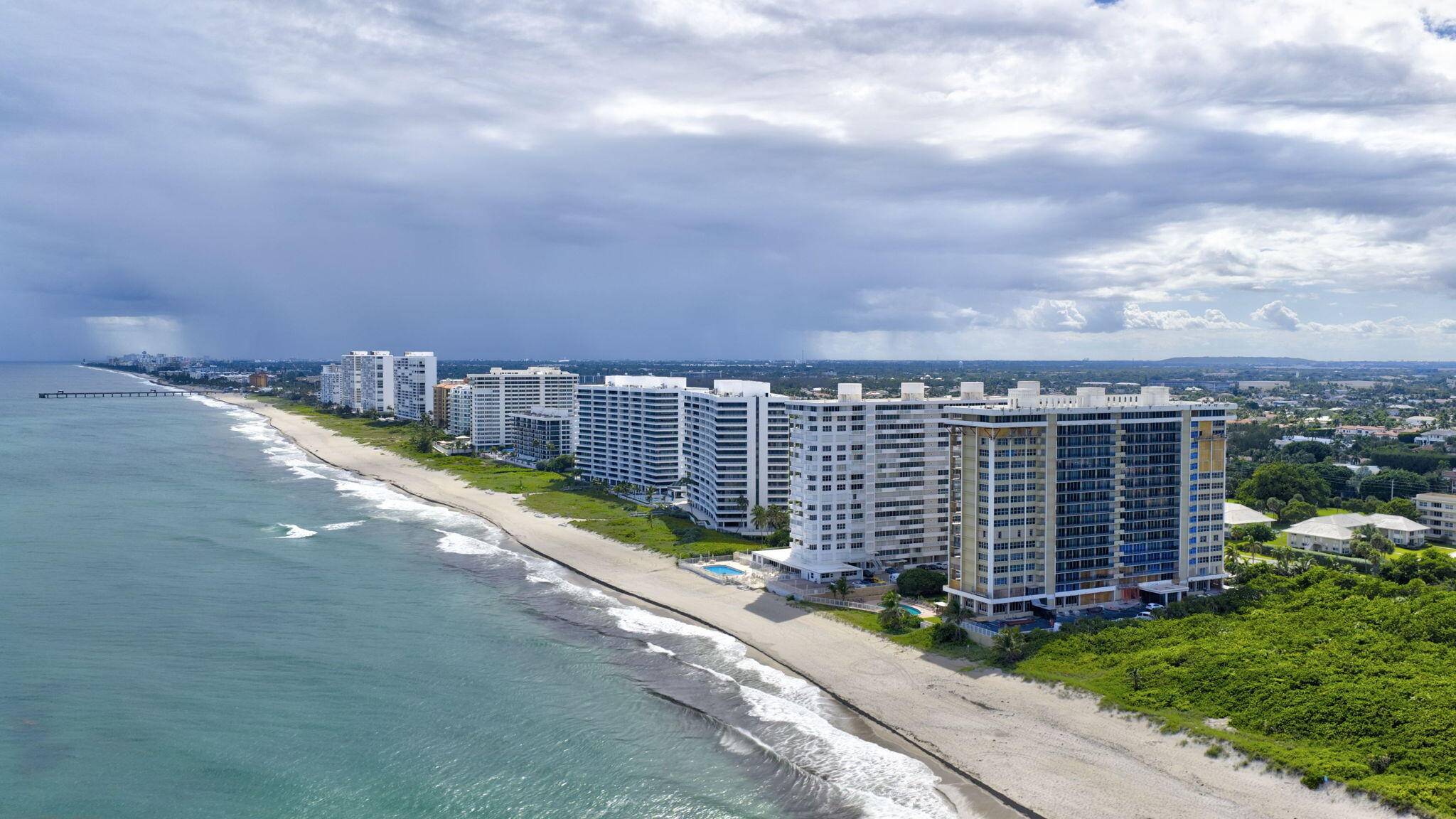 Wake up to breathtaking ocean views in this beautifully updated residence, where sunlight fills a bright, open layout through expansive floor to ceiling impact glass.