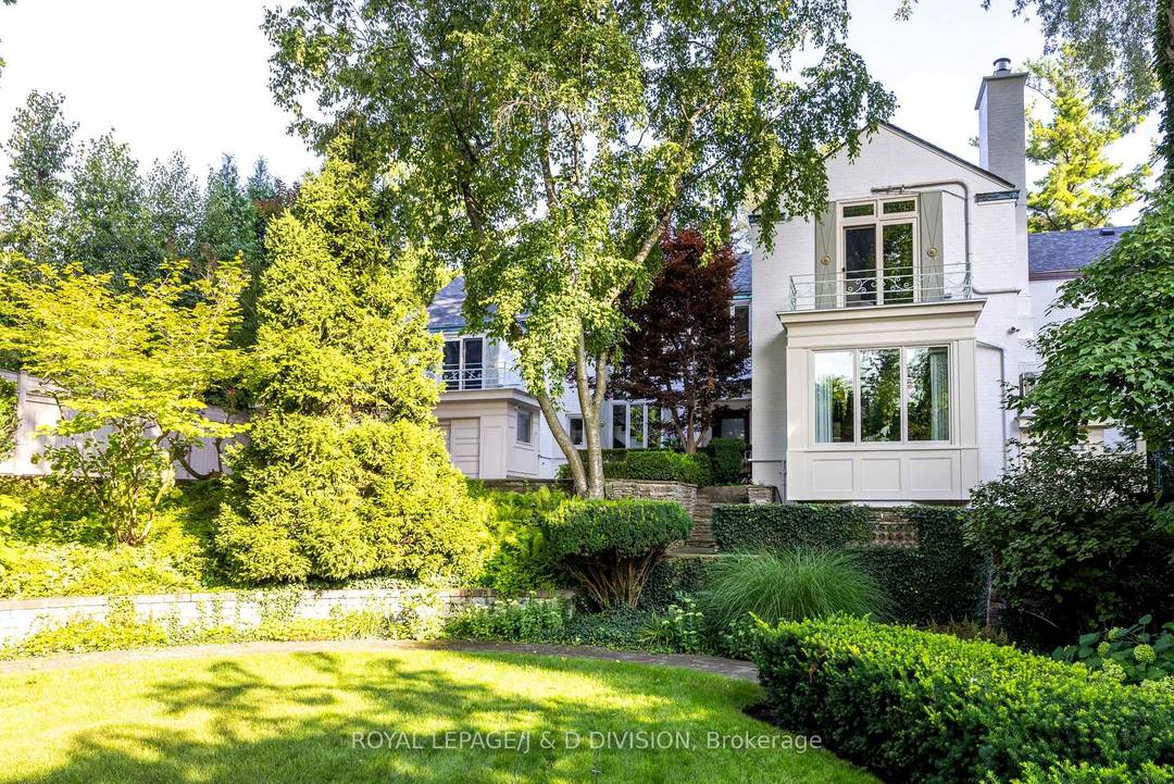 A rare opportunity to own a secluded ravine residence, gracefully set back from the street on an expansive 1 2 acre lot in one of Toronto's most private enclaves.