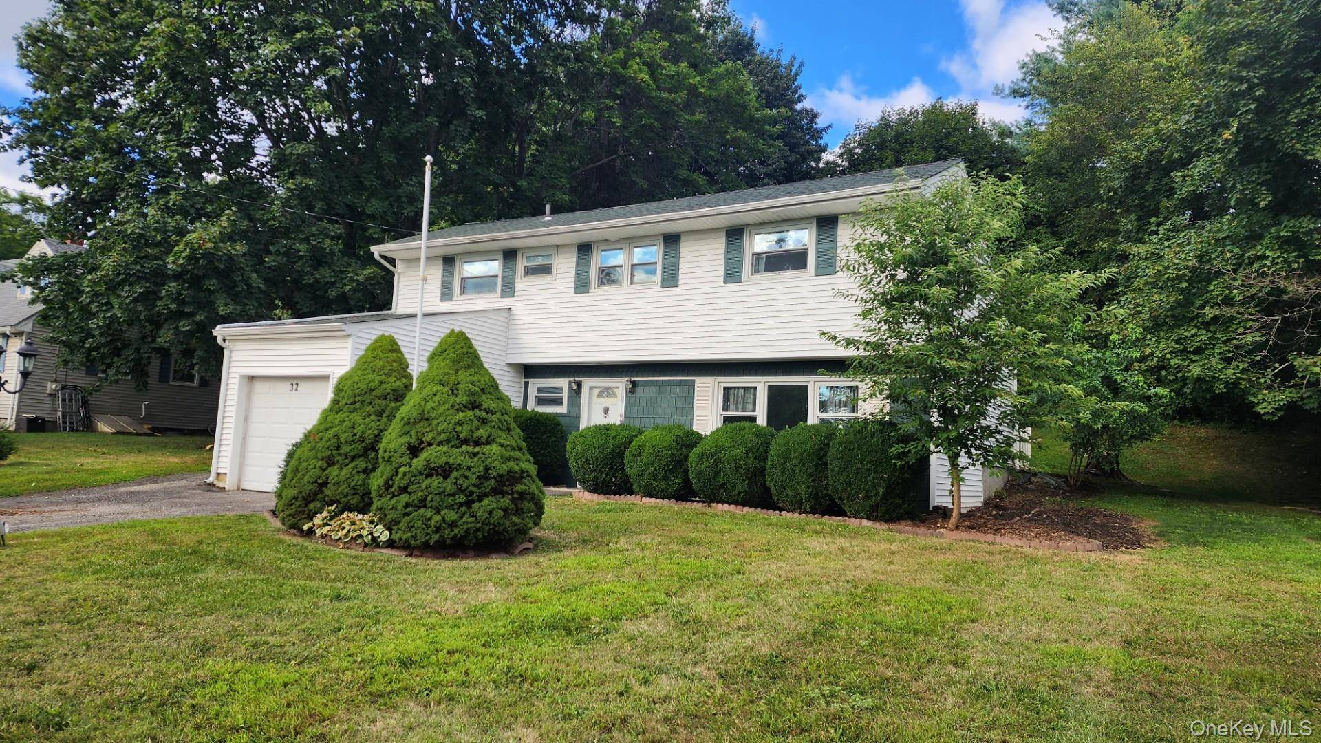 Split style home with 3 bedrooms, 1 bath and a one car garage in Brewster Heights.