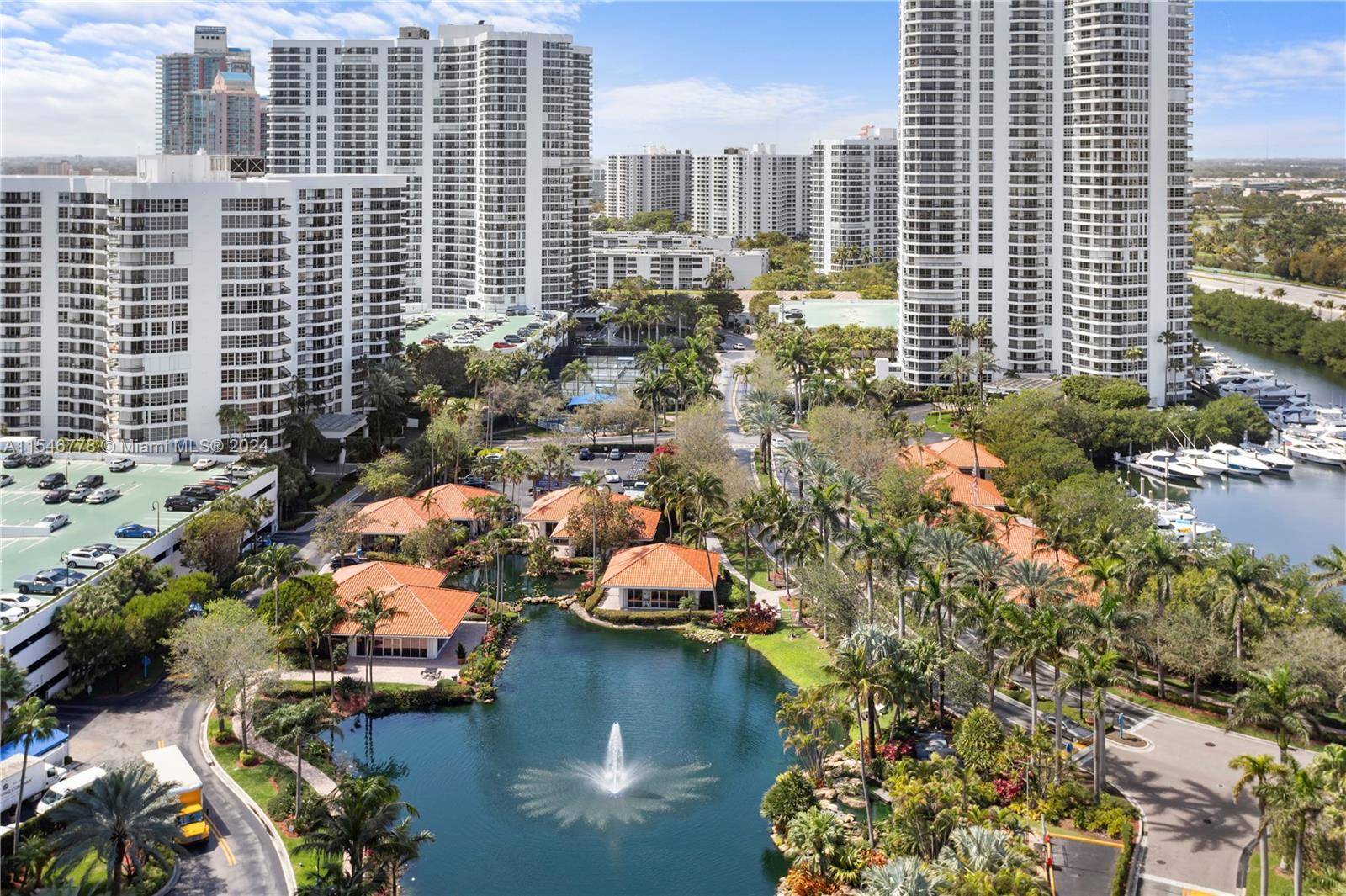 Located in Aventura's prime spot, this 2 bed, 2 bath apartment boasts ample space, abundant natural light, and views of a fountain with a partial intra coastal glimpse.