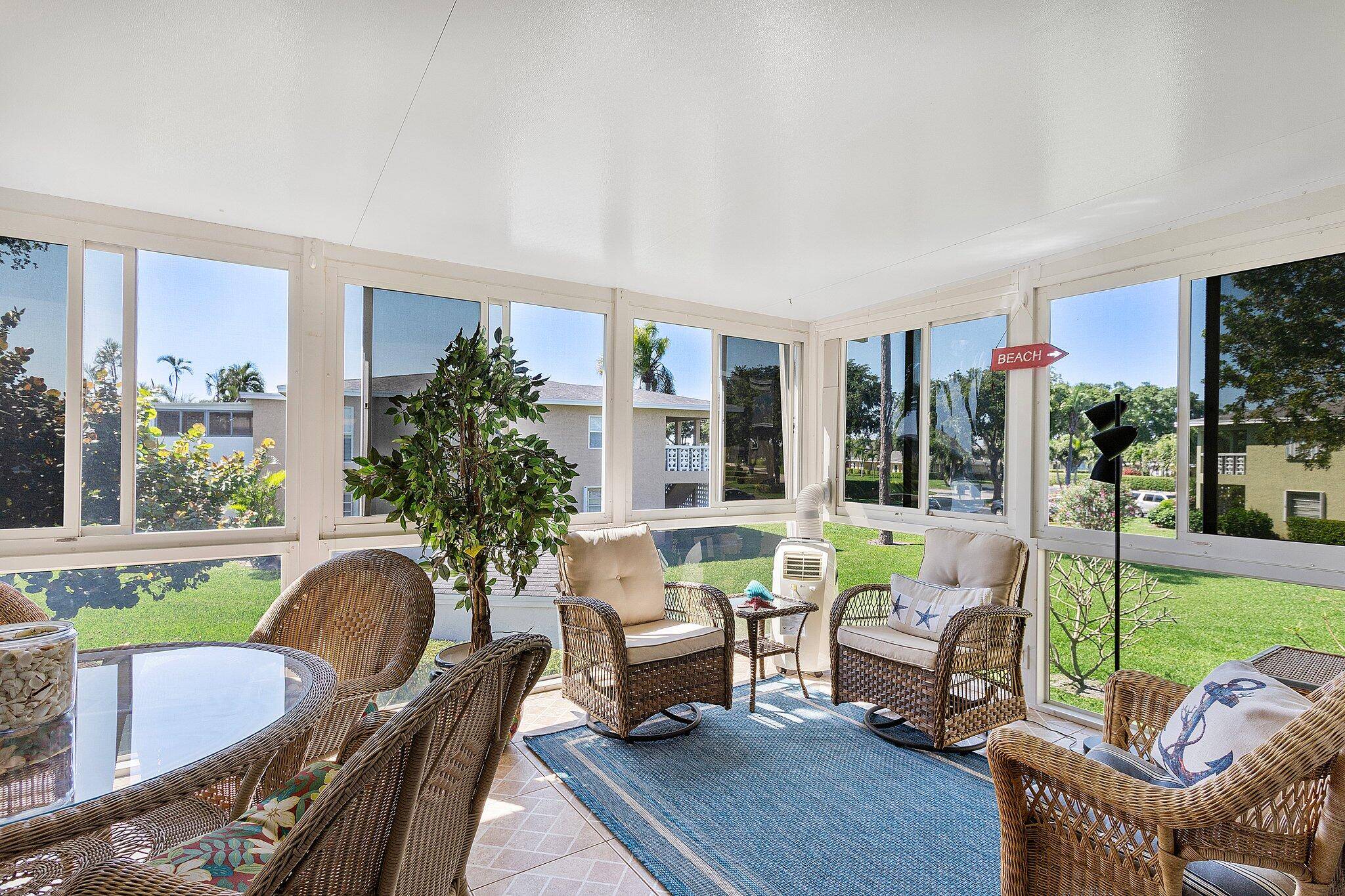 Fully Renovated 2 Bed, 2 Bath Condo with Impact Glass Sunroom Turnkey Ready !