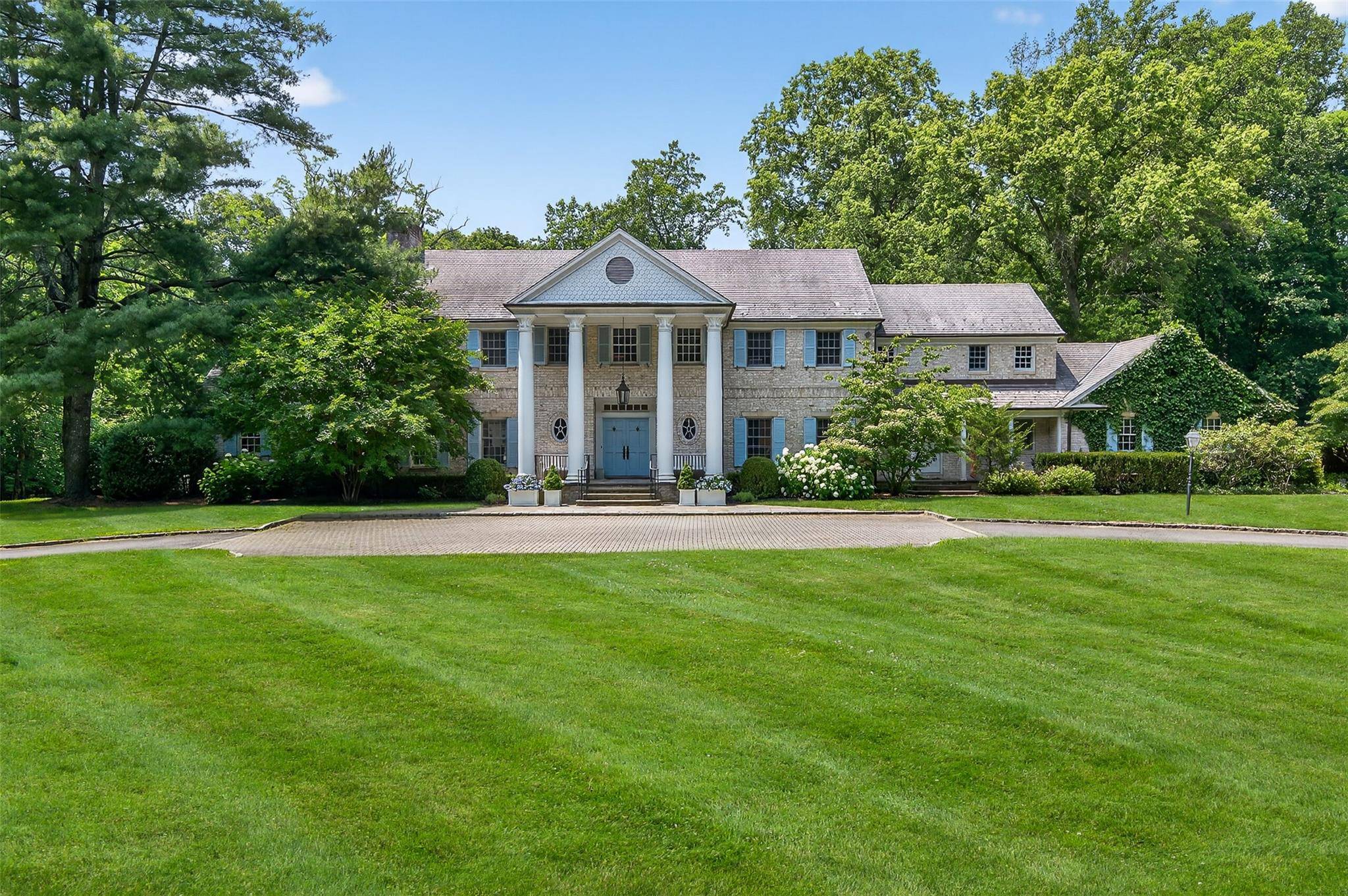 Welcome to 8 Danton Lane, Lattingtown Nestled on four private and beautifully landscaped acres within the coveted Lands End community, this elegant center hall Colonial offers timeless appeal with modern ...