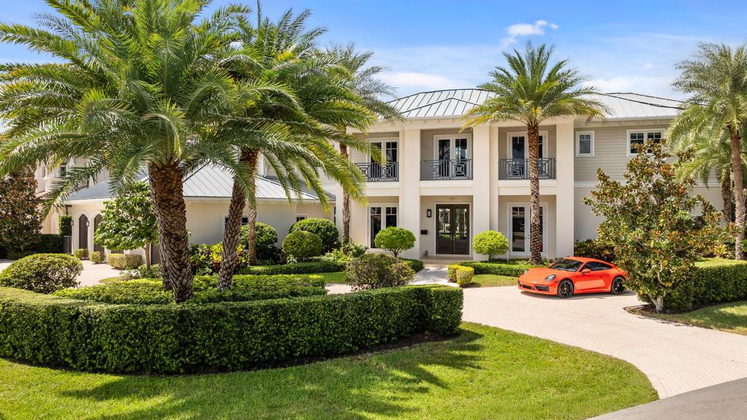 Stunning custom waterfront estate offering 9, 329 sq ft under air and designed for those who appreciate exceptional architecture and effortless entertaining.