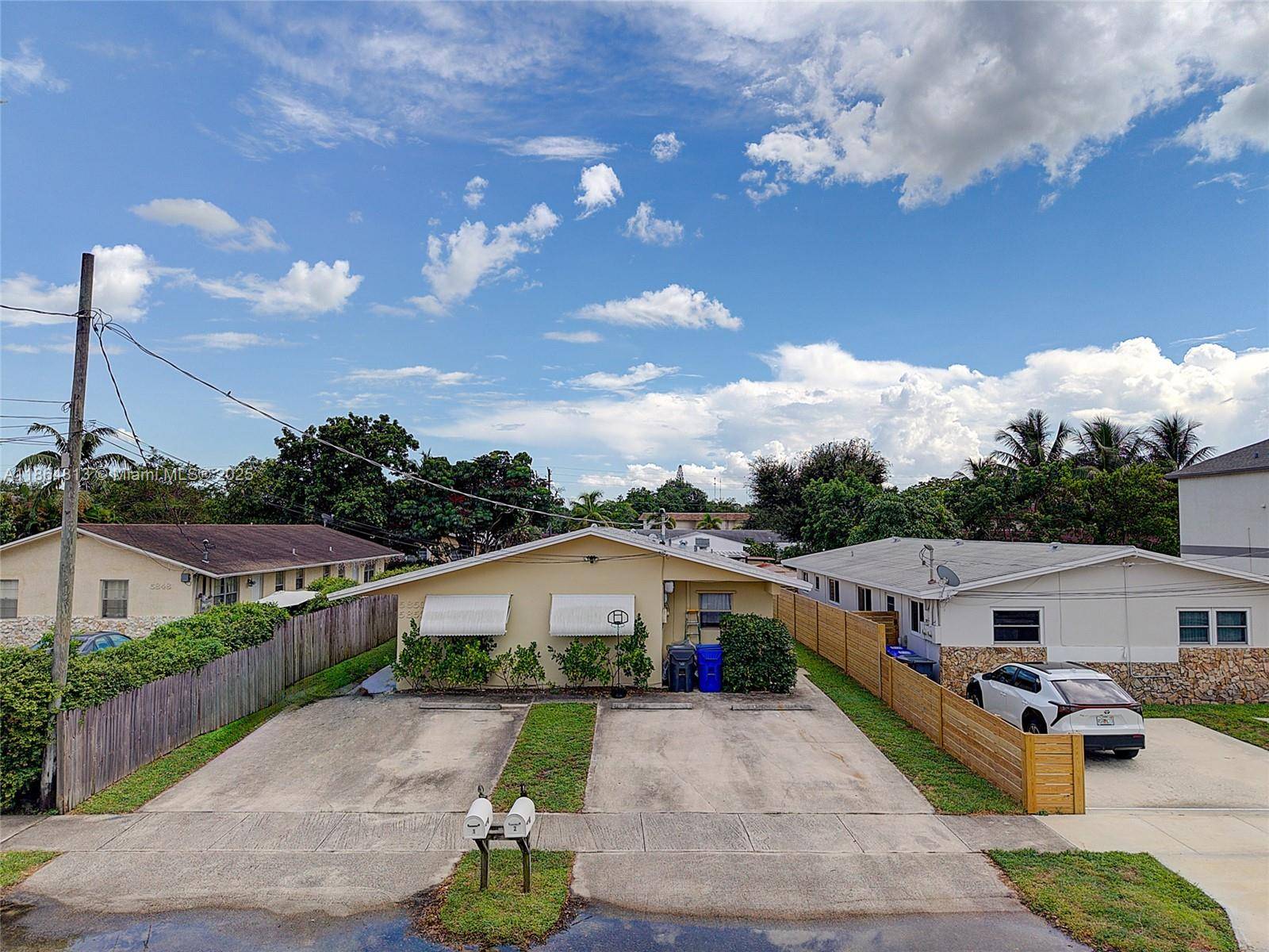 Excellent opportunity to own a large duplex with 4 parking spaces, fenced yard with a huge shed in Hollywood.