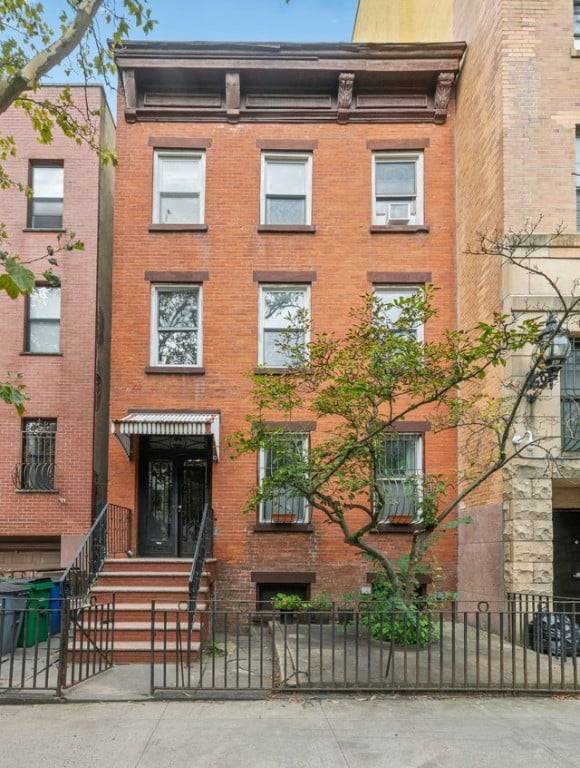 Discover a rare opportunity to own a piece of Brooklyn history at 392 Adelphi Street, a handsome brick townhouse tucked within the coveted Fort Greene Historic District.