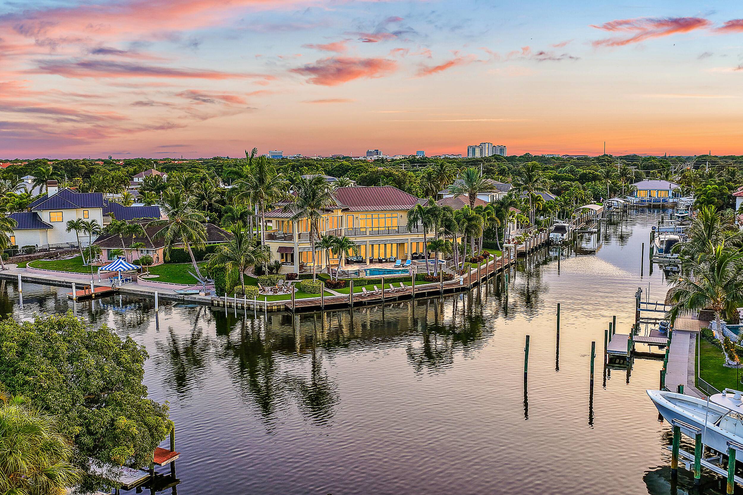 One of a Kind custom estate home on a point lot with turning basin and 210' of protected deep water dockage.
