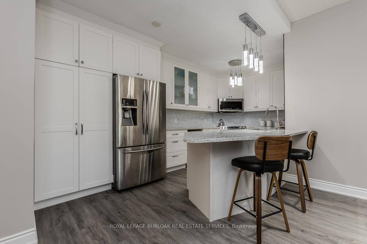 Welcome to this impeccably renovated suite in the highly desirable The Balmoral community.