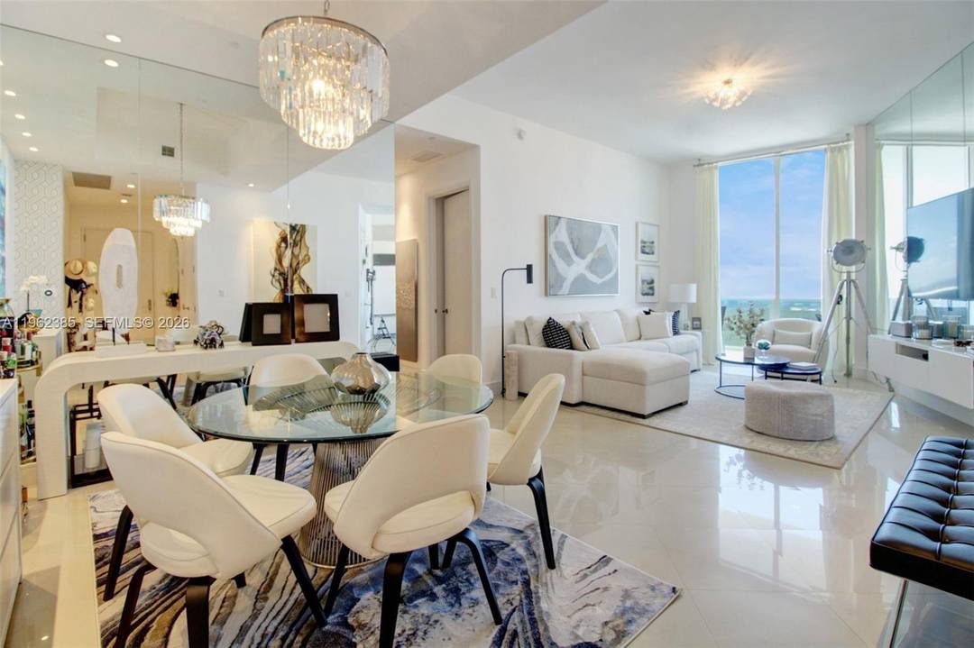 An exceptional residence offering elevated beachfront living from a commanding high floor position in the heart of Sunny Isles Beach.