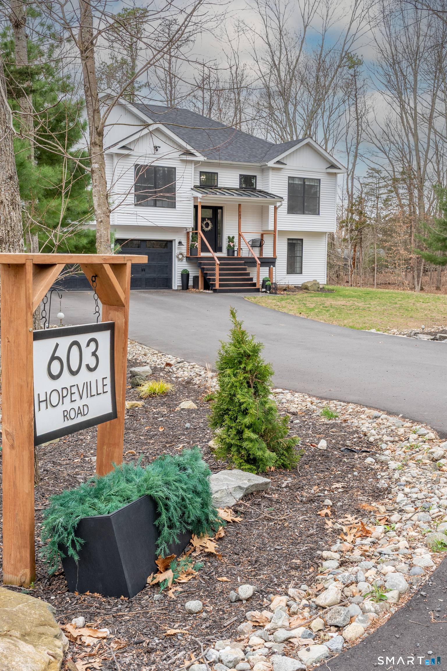 NESTLED back on a long PRIVATE driveway sits a PRISTINE 2021 CUSTOM built home on 3.