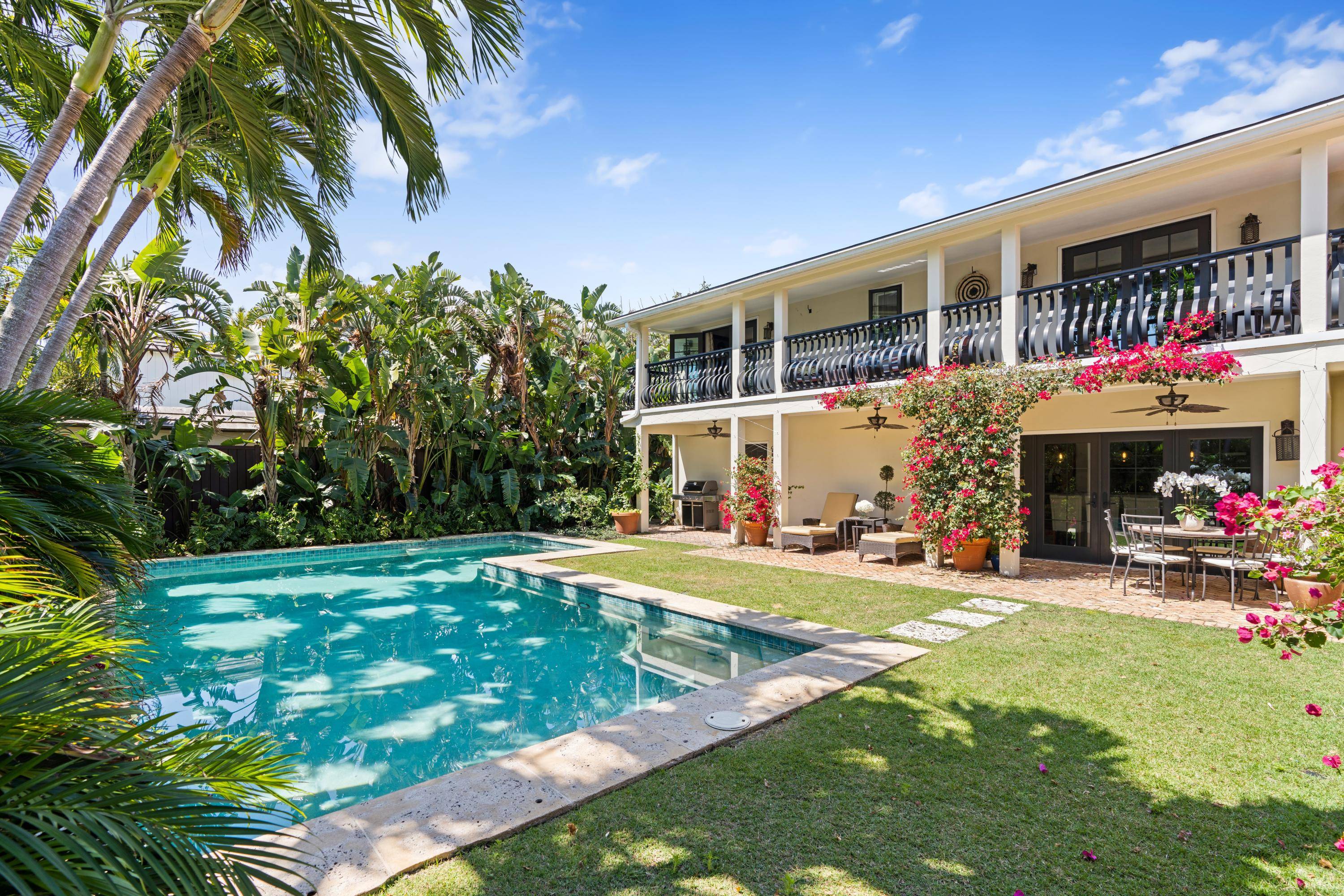 Beautiful designer decorated fully furnished 4 bed home with gorgeous pool, exquisite gardens fountain on oversized corner lot.
