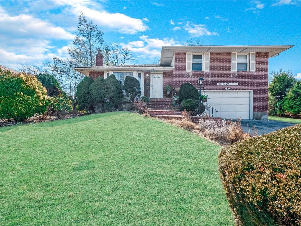 Split Level Home on oversized park like property, featuring Syosset Schools, 4 bedrooms, 2.