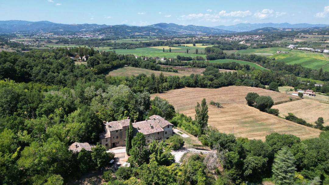 Enchanting XVI-century hamlet converted into a boutique hotel with 15 bedrooms, pool, private chapel, garden and 4 hectares of land for sale in Umbria