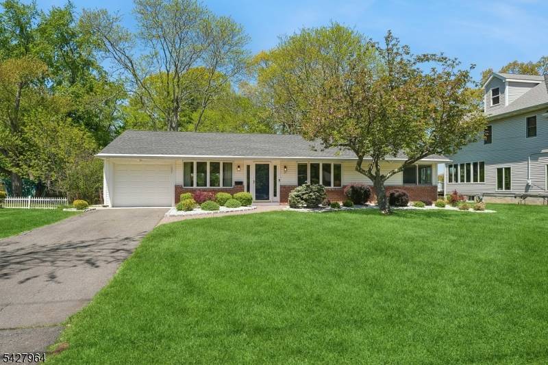 Meticulously maintained and beautifully updated, this exceptional Ranch style residence offers timeless appeal.