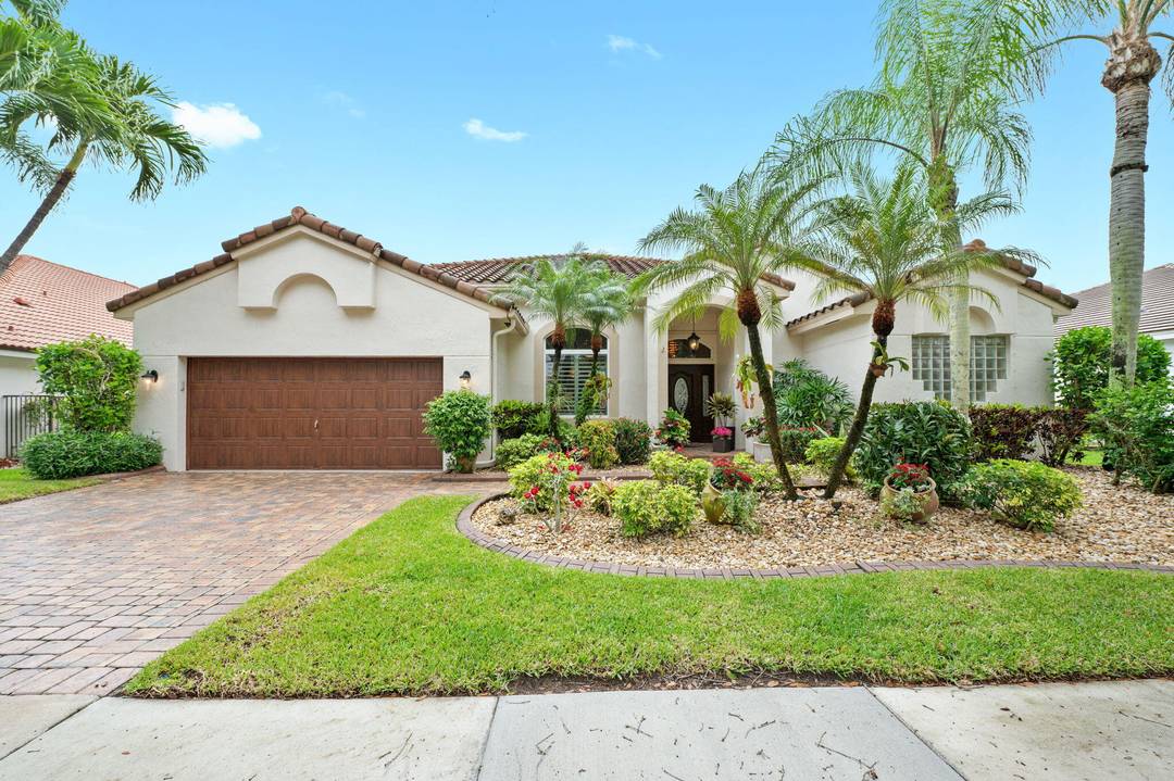 Beautifully updated lakefront pool home ideally situated on a quiet cul de sac street within the sought after golf course community of Weston Hills.