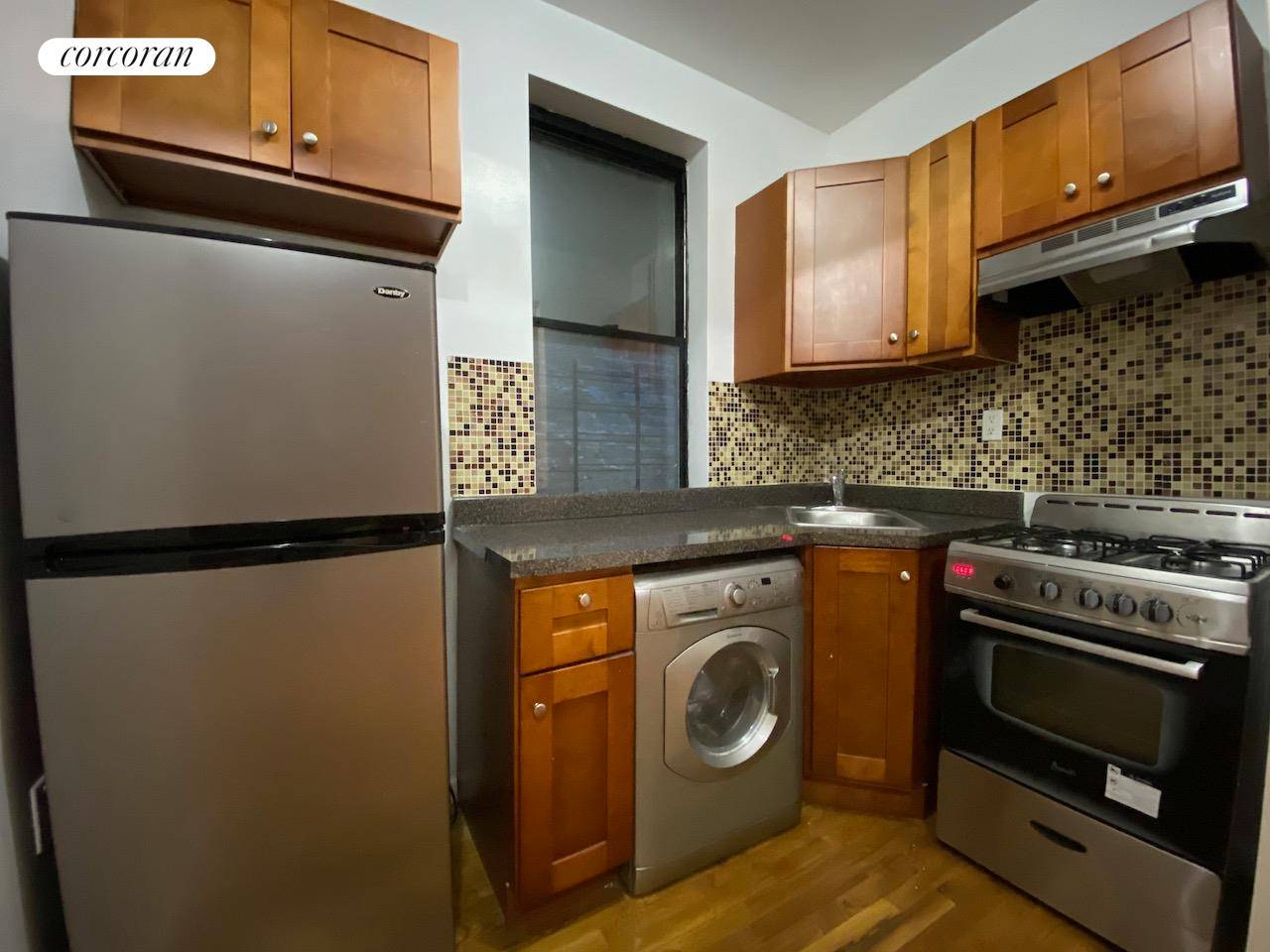 WASHER DRYER IN UNIT ! Renovated 3 bedroom 1 full bath with tub Hardwood floors, exposed brick and sun filled windows !