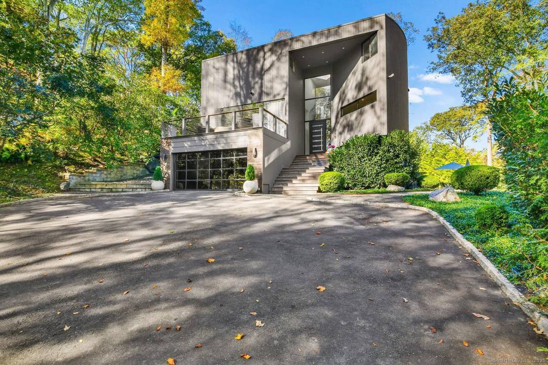 Welcome to 210 Red Fox Road, a stunning hilltop sanctuary nestled on a quiet cul de sac in Stamford, CT.