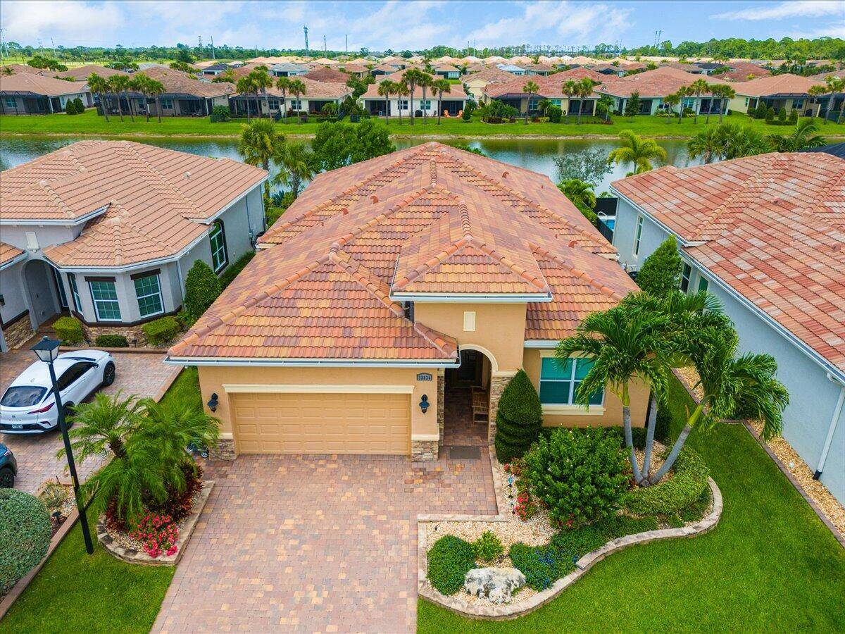 Beautiful Lago Model at Verano PGA Village with mature landscaping lake View.