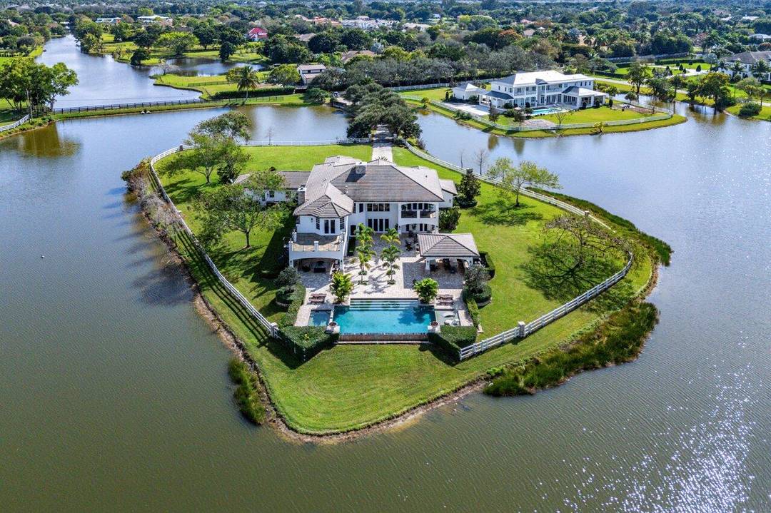 Set on 5. 23 acres within an exclusive gated community of just 78 homes, this exceptional estate offers breathtaking lakefront views and unparalleled privacy.