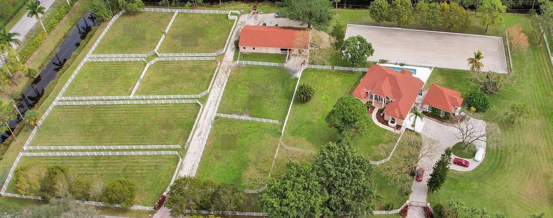 Designed with the equestrian in mind, the property features a 10 stall barn complete with a tack room, feed room, half bath, and laundry area.