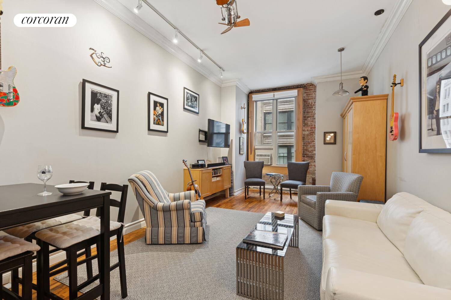 LOFT LIKE STUDIO with HIGH CEILINGS at 11' and OVERSIZED WINDOWS and EXPOSED BRICK adding Charm to the Entire Apartment.