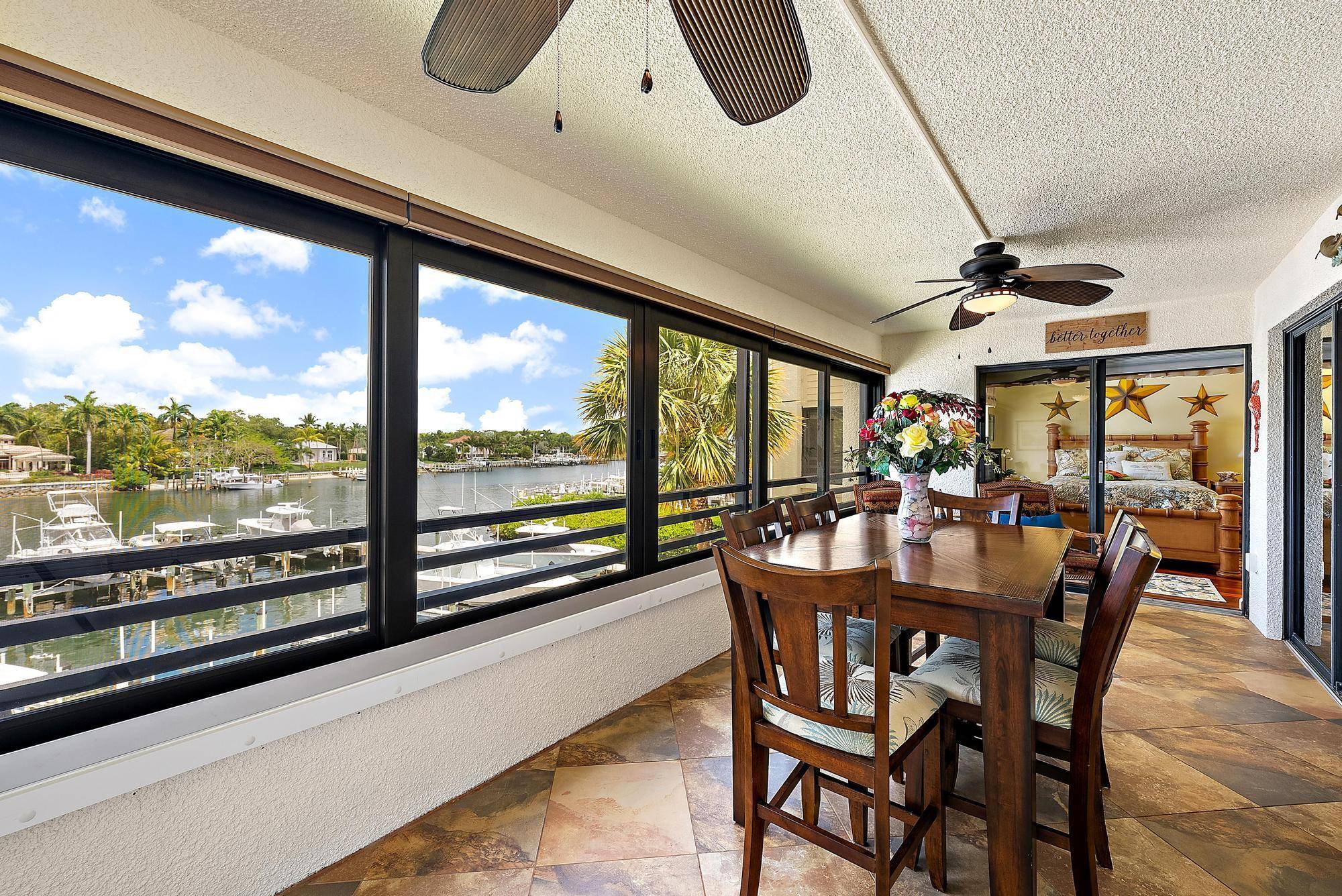 Come watch the boats glide by from this stunning intracoastal front 2 BR, 2 1 2 BA condo.