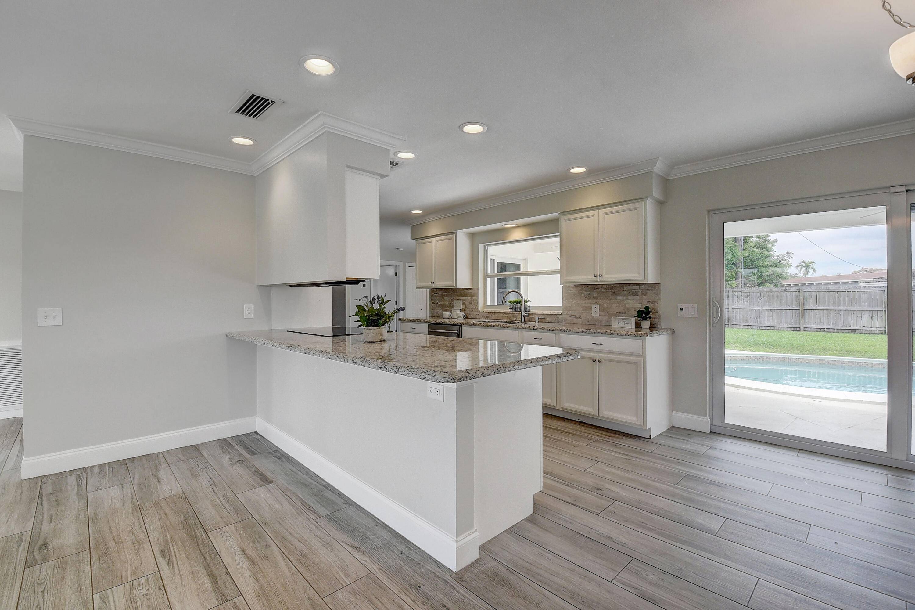 AN EAST BOCA GEM ! COMPLETELY UPDATED, SPLIT FLOOR PLAN, 4 BEDROOMS, 3 FULL BATHS, 2 CAR GARAGE WITH A POOL !