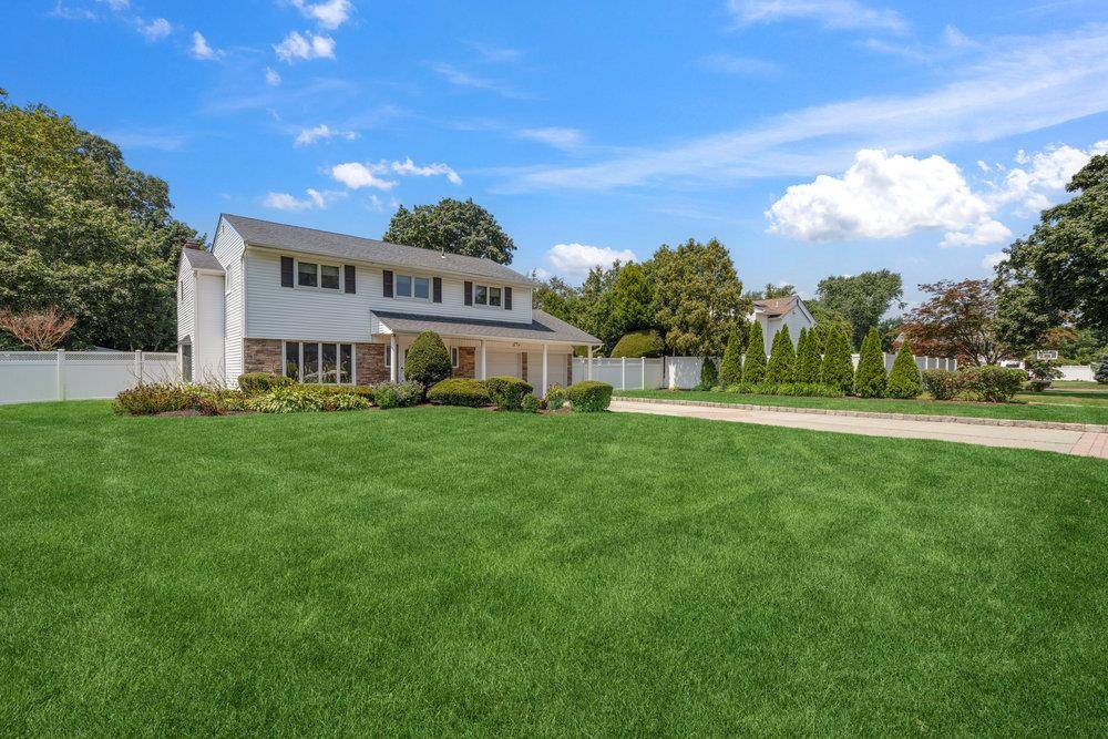 Located in the heart of East Northport and within the highly rated Commack School District, this spacious 4 bedroom, 2.