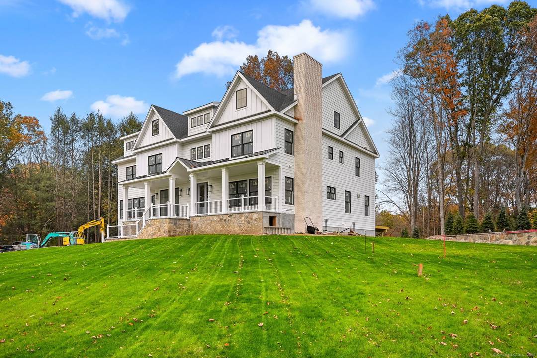 Welcome to 150 Wildwood Road, an exceptional new construction residence that perfectly blends timeless colonial architecture with modern sophistication.