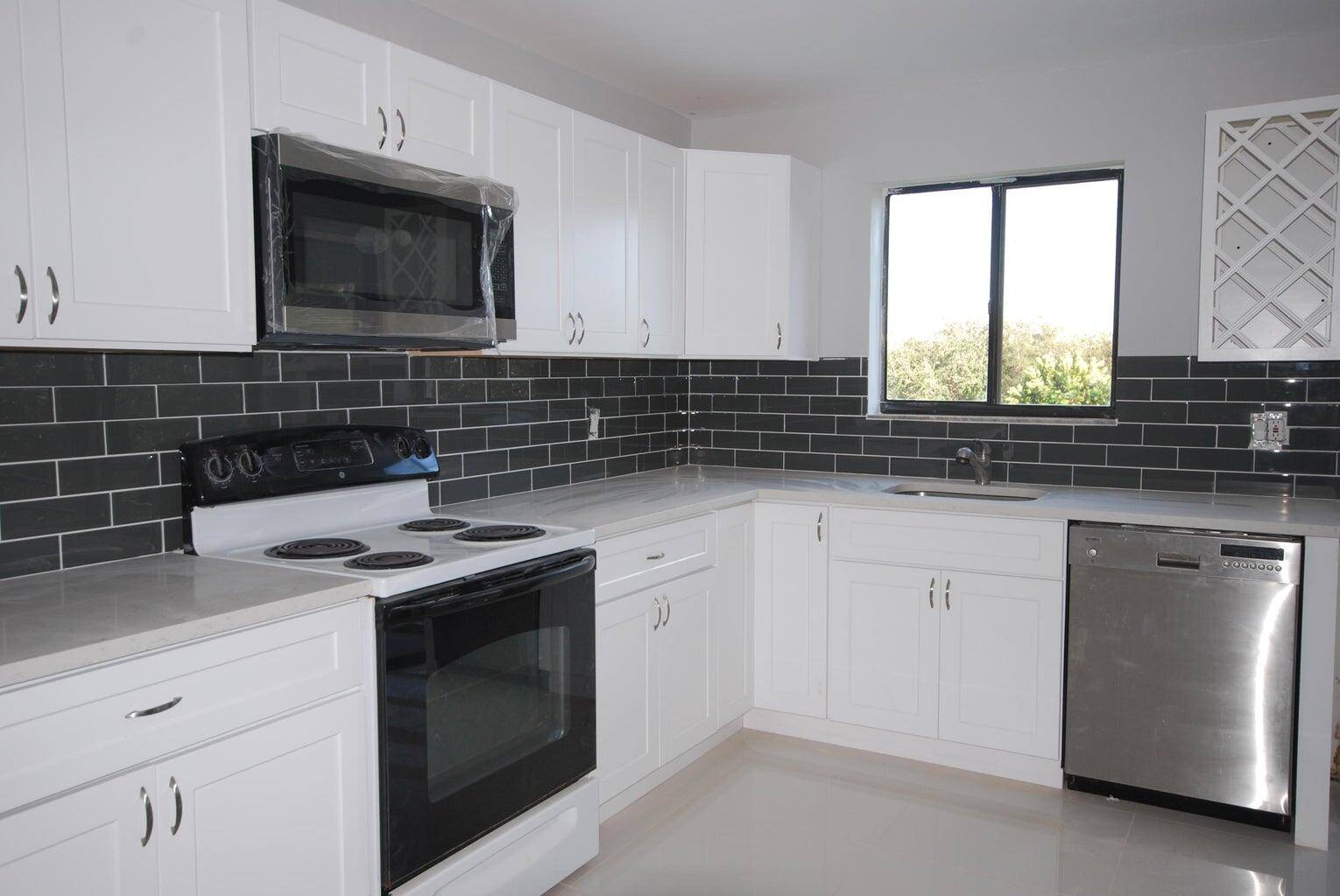 INVESTORS' CALL ! ! Beautifully updated two bedroom, two bathroom condo with a large additional den flex room.