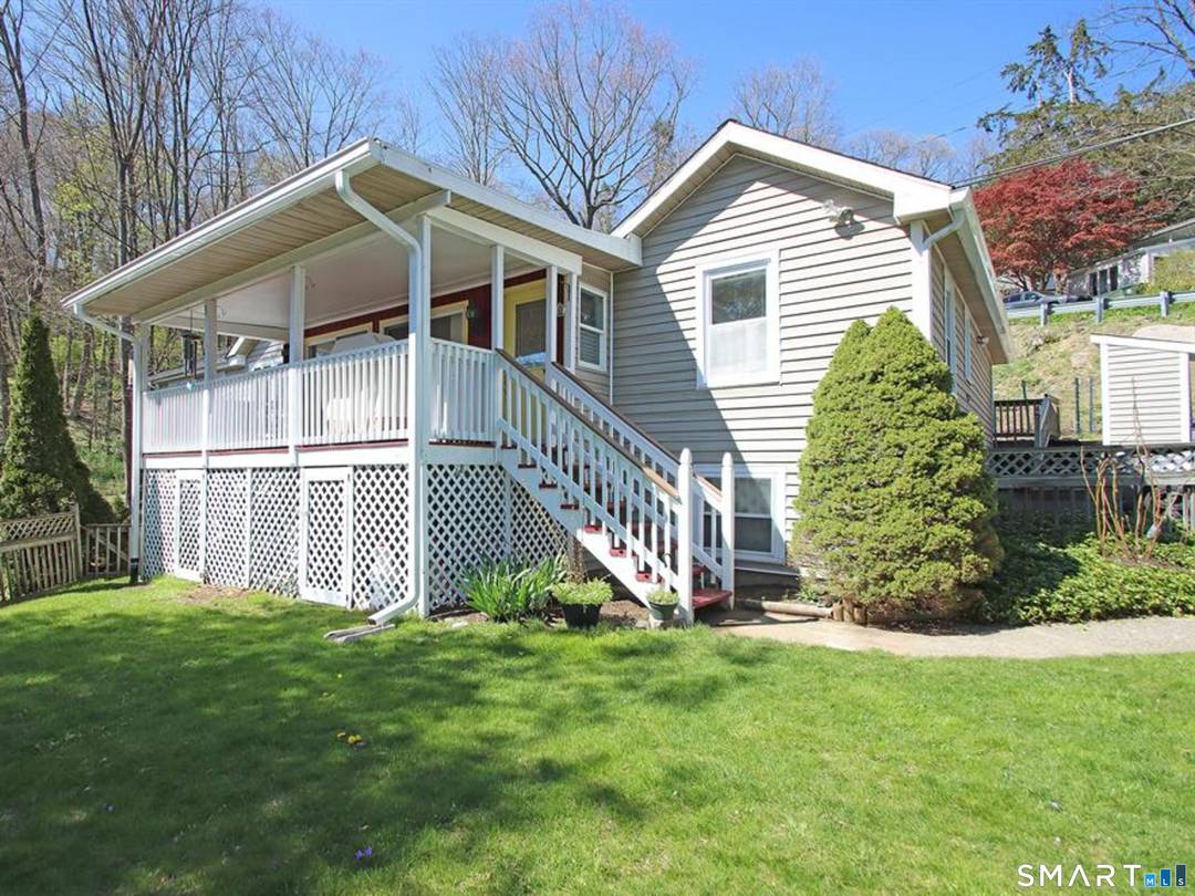 Welcome to your lakeside retreat on Candlewood Lake a home that adapts beautifully to your lifestyle, whether you're dreaming of a comfortable year round residence or a peaceful weekend escape.