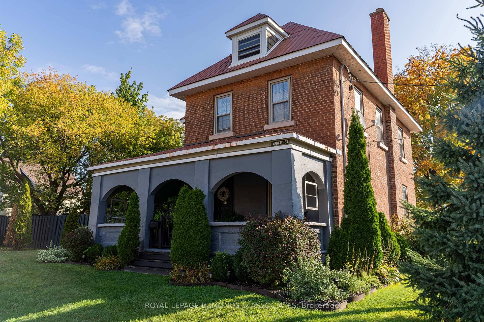 Step into timeless elegance with this all brick Victorian home perfectly situated on a prominent corner lot right in the heart of Pembroke.
