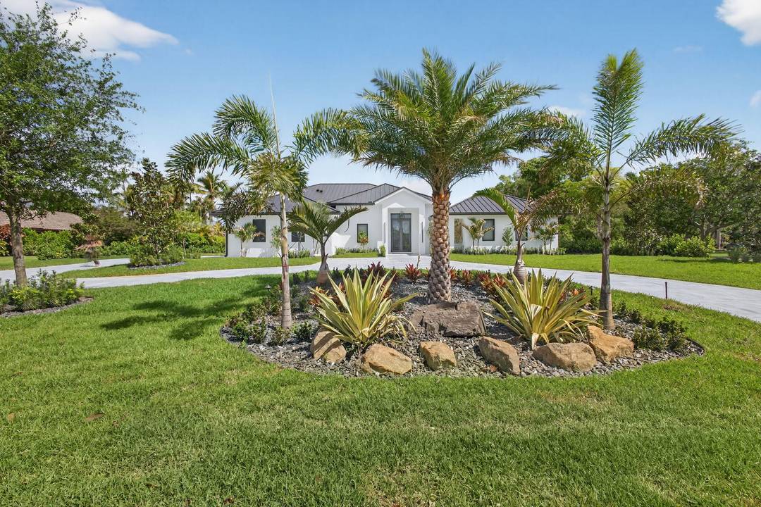 Completely reimagined, this custom designed rebuilt coastal style home in Steeplechase sits on a pristine 1 acre corner lot and lives like a brand new luxury residence.