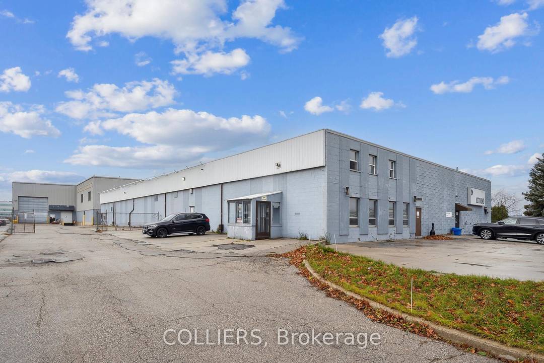 A freestanding building featuring heavy power with three separate services to the building 1, 600 Amps, 600 amps, and 400 amps, oversized doors, cranes, and a paint booth, with a ...