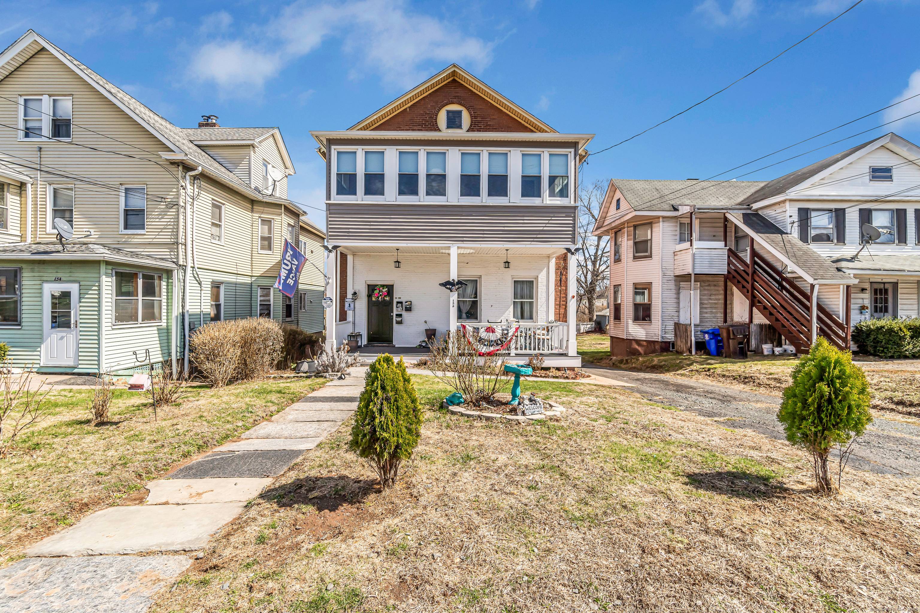 Pull into the long private driveway room for 6 8 cars and you'll feel the instant charm of this beautifully renovated brick two family.