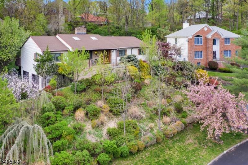 Perched gracefully on a hill in sought after Mountainside, this spacious and light filled 4 bedroom, 3 full bath ranch offers the ease of one floor living in a setting ...