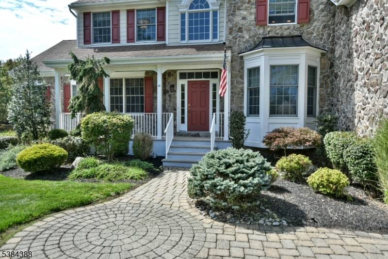 Welcome to this exquisite home nestled at the end of a cul de sac on a beautifully landscaped lot.