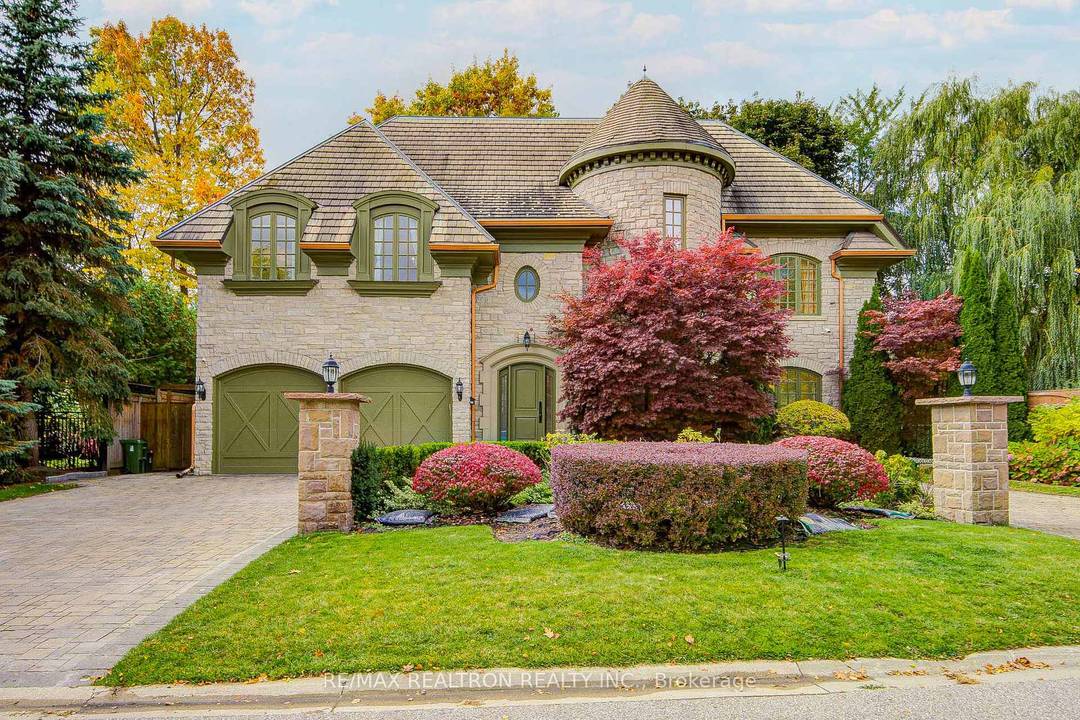 This spectacular, custom crafted, architecturally designed 23 year new residence is nestled on a quiet cul de sac in the prestigious St.